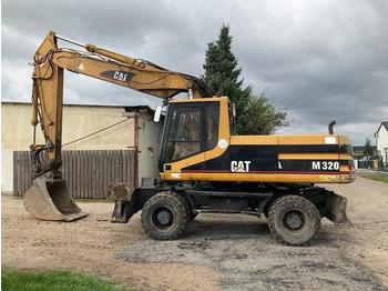Excavator pe roţi CATERPILLAR M320