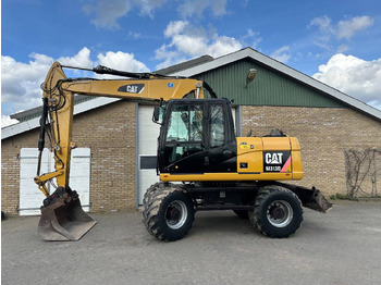 Excavator pe roţi CATERPILLAR M313D