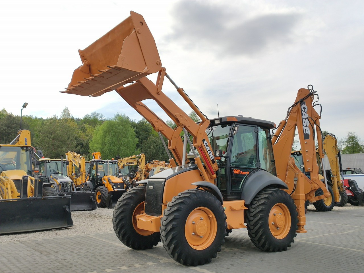 Case 695SR2-4PS - Buldoexcavator: Foto 1 Case 695SR2-4PS - Buldoexcavator: Foto 1