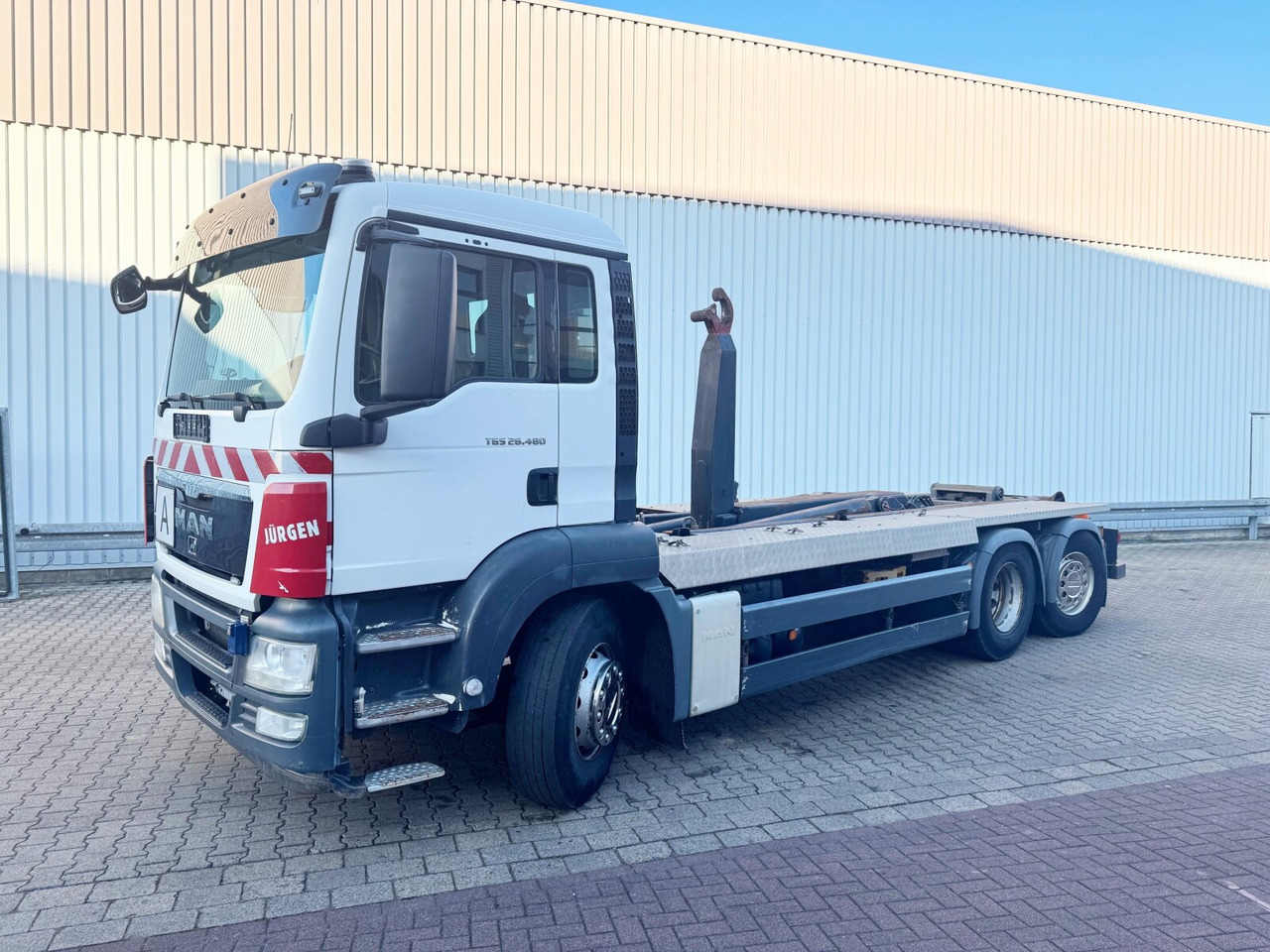 MAN TGS 26.480 6x2-4 BL TGS 26.480 6x2-4 BL, Lenk-Liftachse, VDL Abrollkipper bis 7m Container - Camion cu cârlig: Foto 1 MAN TGS 26.480 6x2-4 BL TGS 26.480 6x2-4 BL, Lenk-Liftachse, VDL Abrollkipper bis 7m Container - Camion cu cârlig: Foto 1