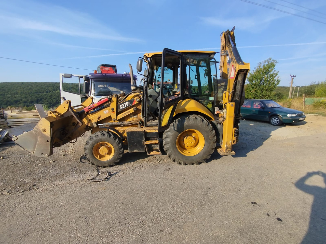 CATERPILLAR 472F2 - Buldoexcavator: Foto 1 CATERPILLAR 472F2 - Buldoexcavator: Foto 1