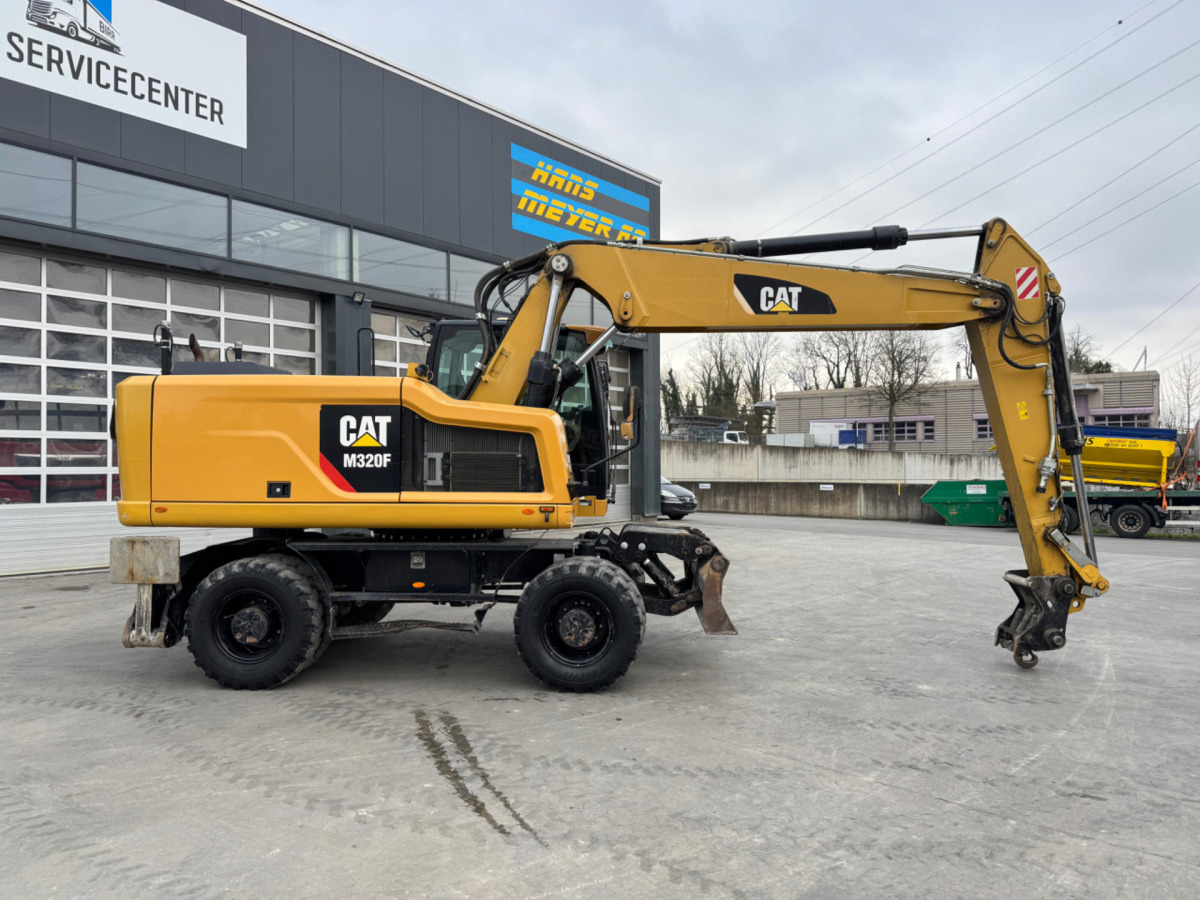 CATERPILLAR M320F Oilquick - Excavator pe roţi: Foto 3 CATERPILLAR M320F Oilquick - Excavator pe roţi: Foto 3
