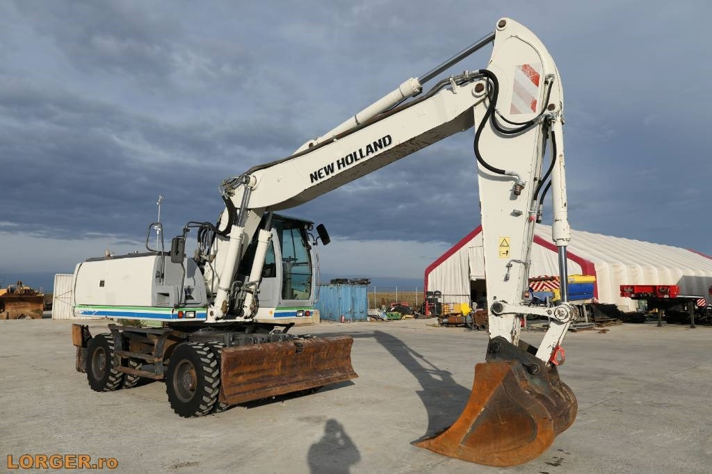 New Holland MH 6.6 + Sandvic Hammer - Excavator pe roţi: Foto 5 New Holland MH 6.6 + Sandvic Hammer - Excavator pe roţi: Foto 5