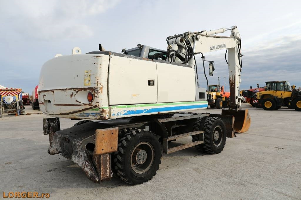 New Holland MH 6.6 + Sandvic Hammer - Excavator pe roţi: Foto 4 New Holland MH 6.6 + Sandvic Hammer - Excavator pe roţi: Foto 4