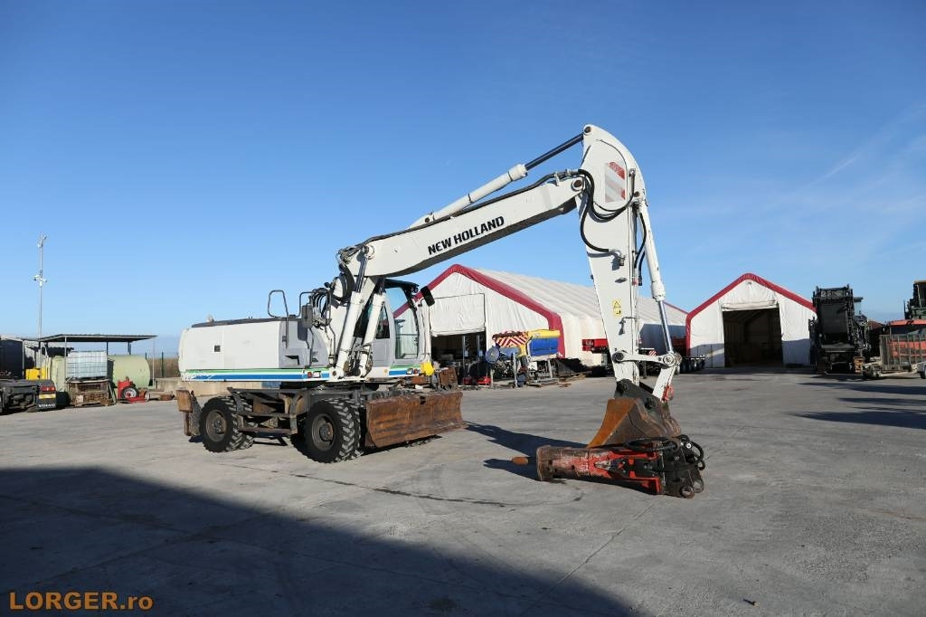 New Holland MH 6.6 + Sandvic Hammer - Excavator pe roţi: Foto 2 New Holland MH 6.6 + Sandvic Hammer - Excavator pe roţi: Foto 2