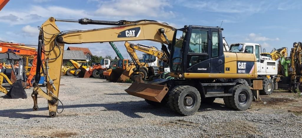 CAT M 315 D - Excavator pe roţi: Foto 1 CAT M 315 D - Excavator pe roţi: Foto 1