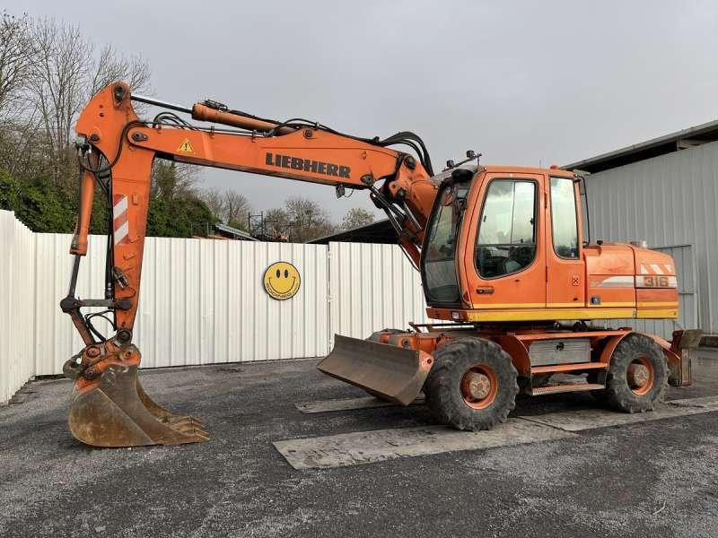 Liebherr A316 LITRONIC - Excavator pe roţi: Foto 1 Liebherr A316 LITRONIC - Excavator pe roţi: Foto 1