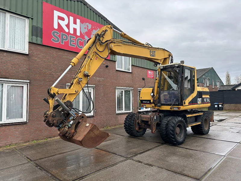 Caterpillar M315 +ROTO CE - Excavator pe roţi: Foto 2 Caterpillar M315 +ROTO CE - Excavator pe roţi: Foto 2